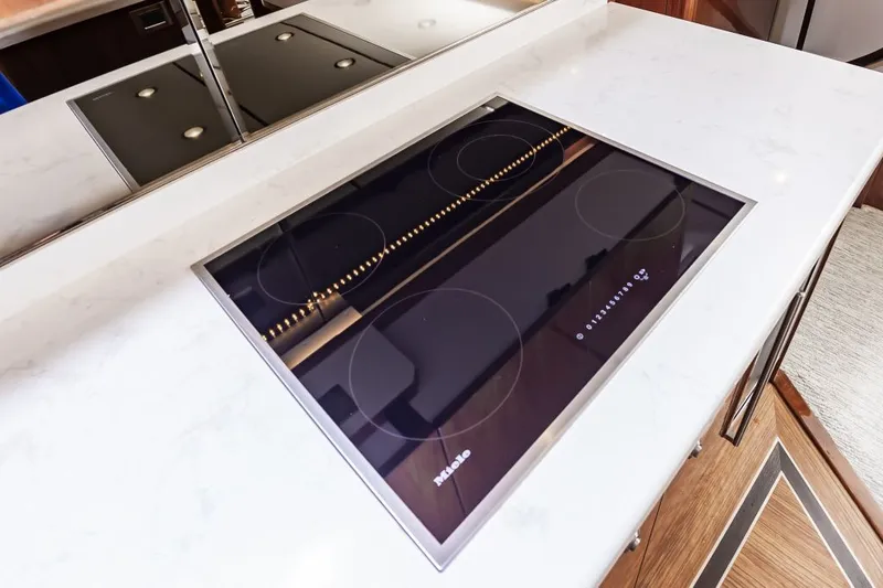 Safari Yacht Photos Pics Modern kitchen cooktop on Viking 72 Convertible yacht, 2022 model.