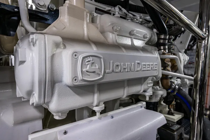 Oasis Yacht Photos Pics Close-up of a John Deere engine component in a 2024 Northwest 55 model.
