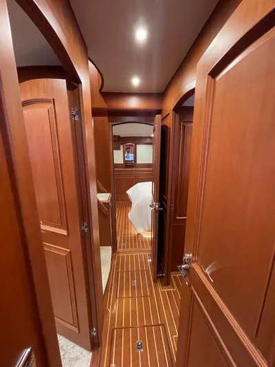 Oasis Yacht Photos Pics Luxurious wooden interior of 2024 Northwest 55 yacht hallway.