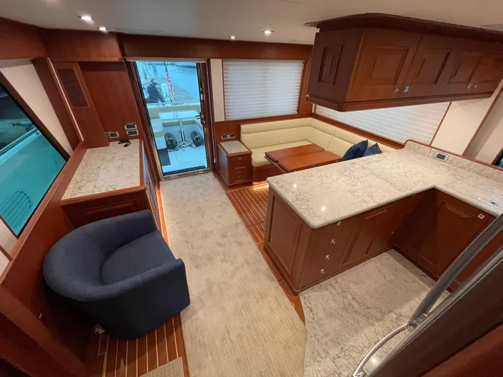 Oasis Yacht Photos Pics Luxurious interior of 2024 Northwest 55 yacht with elegant wood and marble finishes.