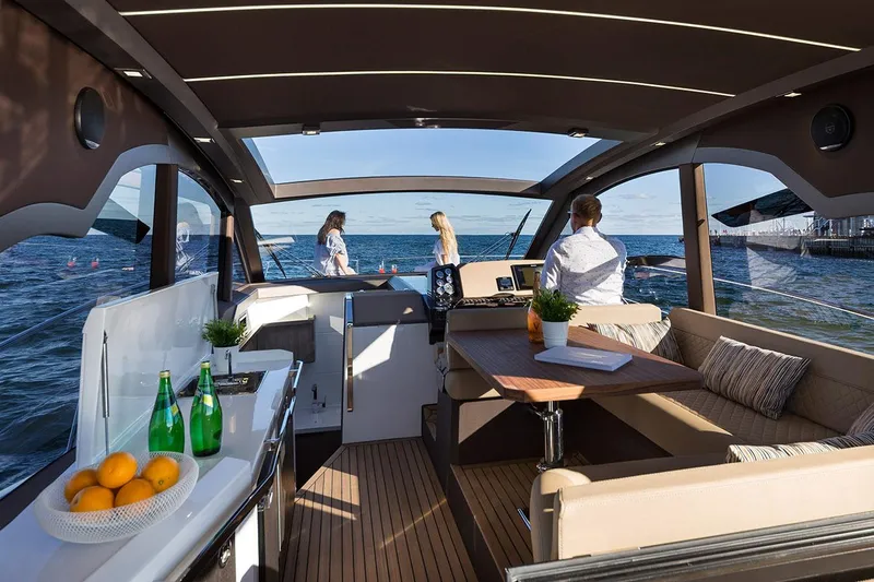  Yacht Photos Pics Manufacturer Provided Image: Interior of 2021 Galeon 425 HTS yacht with people enjoying the sea view.