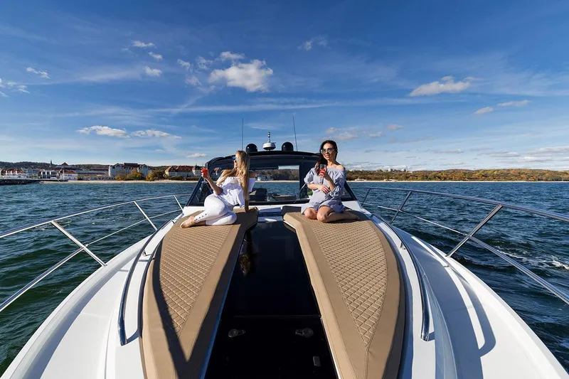  Yacht Photos Pics Manufacturer Provided Image: Two people relaxing on the deck of a 2021 Galeon 425 HTS yacht.