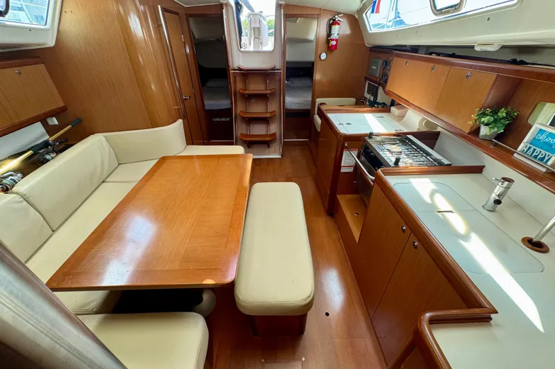  Yacht Photos Pics 2008 Beneteau Oceanis 40 interior with wood finish, dining area, and kitchen amenities.