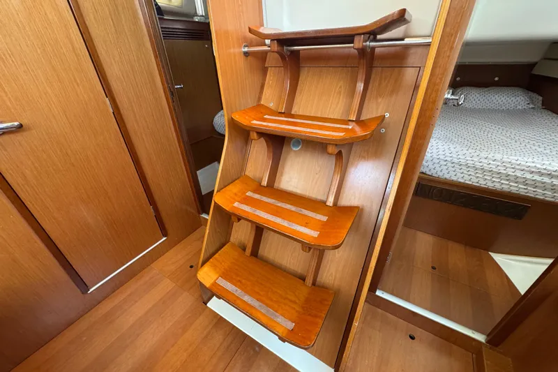  Yacht Photos Pics Interior of 2008 Beneteau Oceanis 40 yacht, featuring wooden steps and cabin entrance.