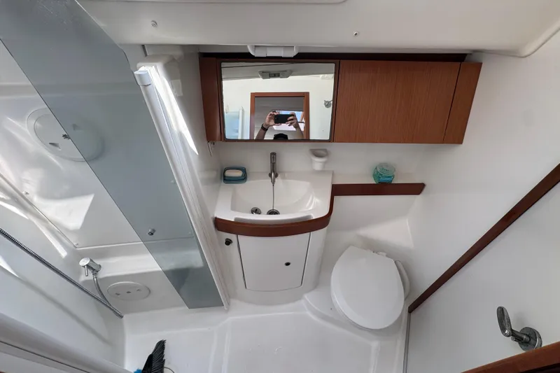  Yacht Photos Pics Interior of 2008 Beneteau Oceanis 40 yacht bathroom with sink, toilet, and shower.