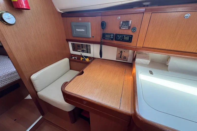  Yacht Photos Pics Interior of 2008 Beneteau Oceanis 40 yacht with navigation equipment and seating area.