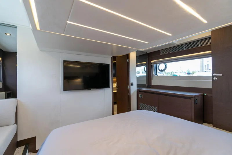  Yacht Photos Pics Luxurious interior of 2022 Prestige 520 yacht with modern design and flat-screen TV.