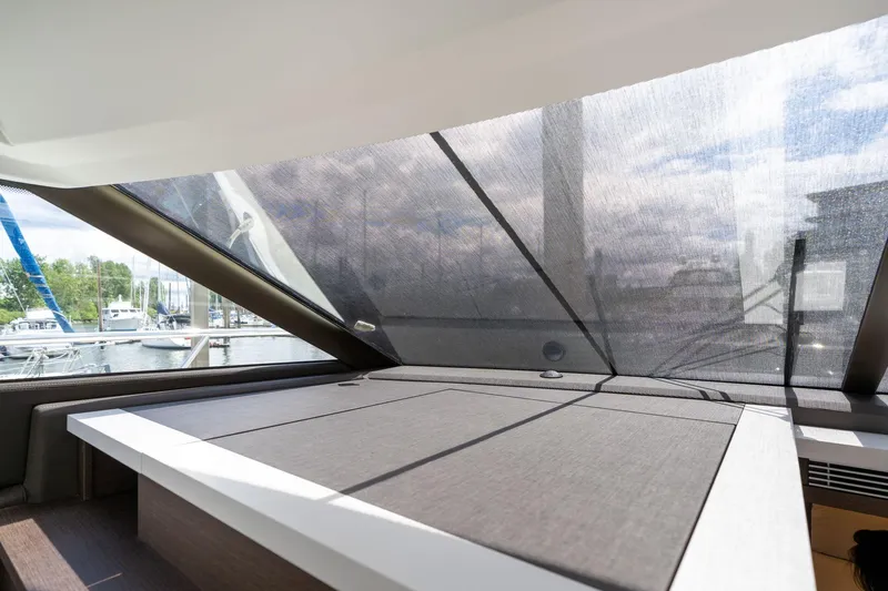  Yacht Photos Pics Interior view of 2022 Prestige 520 yacht with large windows and modern design.