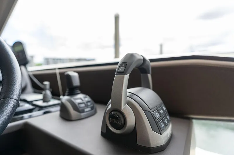  Yacht Photos Pics Control panel of a 2022 Prestige 520 yacht, featuring modern throttle and joystick.