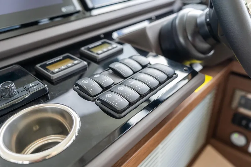  Yacht Photos Pics Control panel of a 2022 Prestige 520 yacht with buttons and displays.