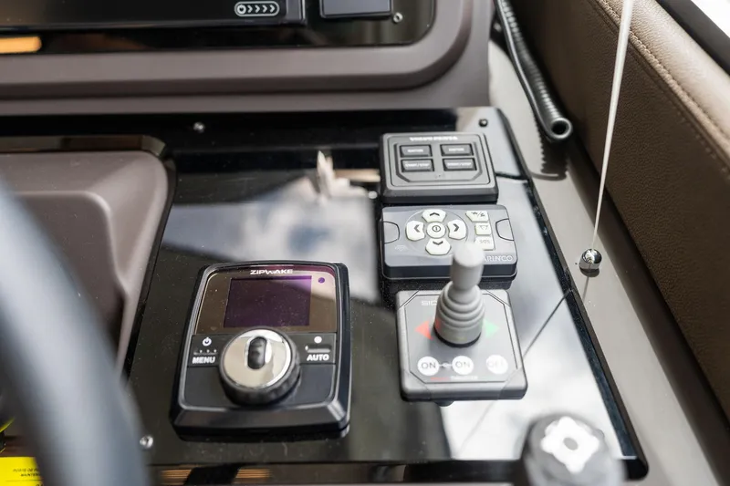  Yacht Photos Pics Control panel of a 2022 Prestige 520 yacht with navigation and joystick controls.