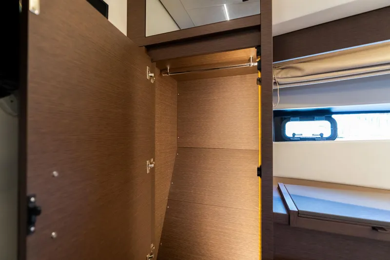  Yacht Photos Pics Empty wooden closet interior on a 2022 Prestige 520 yacht.