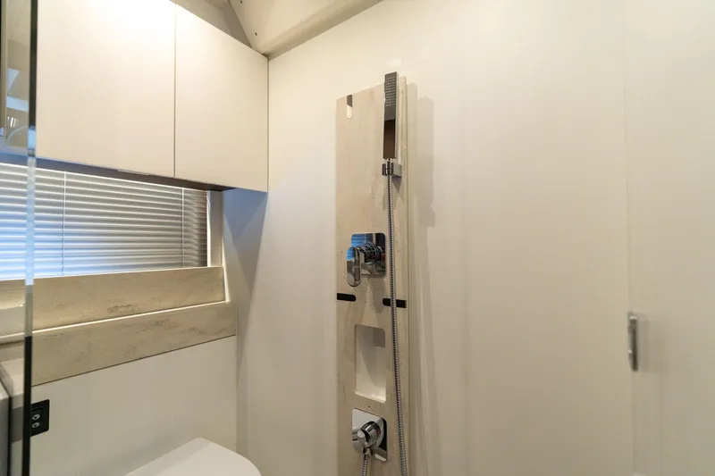 Yacht Photos Pics Modern bathroom interior in 2022 Prestige 520 yacht, featuring sleek shower design.