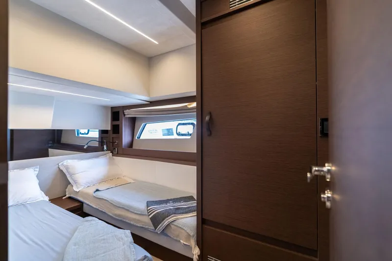  Yacht Photos Pics Luxurious cabin interior of 2022 Prestige 520 yacht with twin beds and modern design.