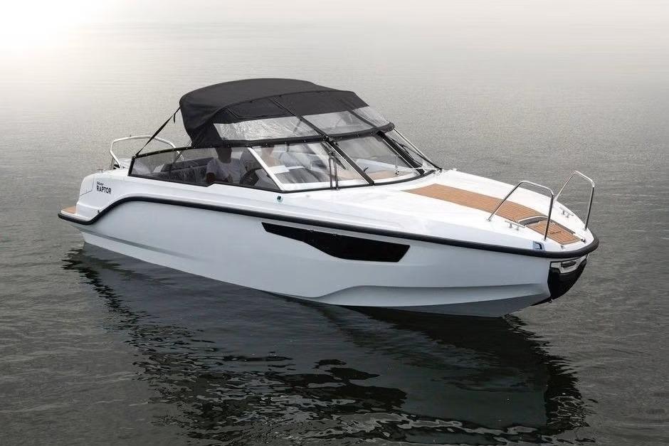 2023 Silver Raptor DCz boat with sleek design on calm water.