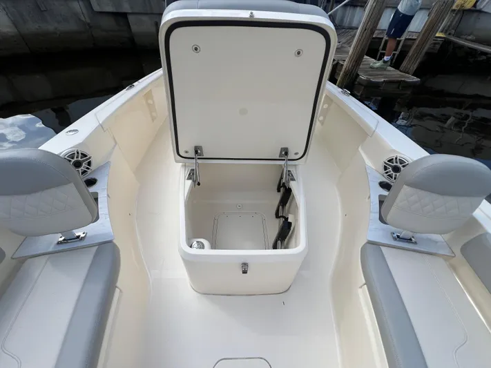  Yacht Photos Pics 2025 Scout 261 XSS boat interior with open storage compartment and seating.