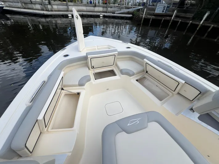  Yacht Photos Pics 2025 Scout 261 XSS boat interior with open storage compartments and seating.