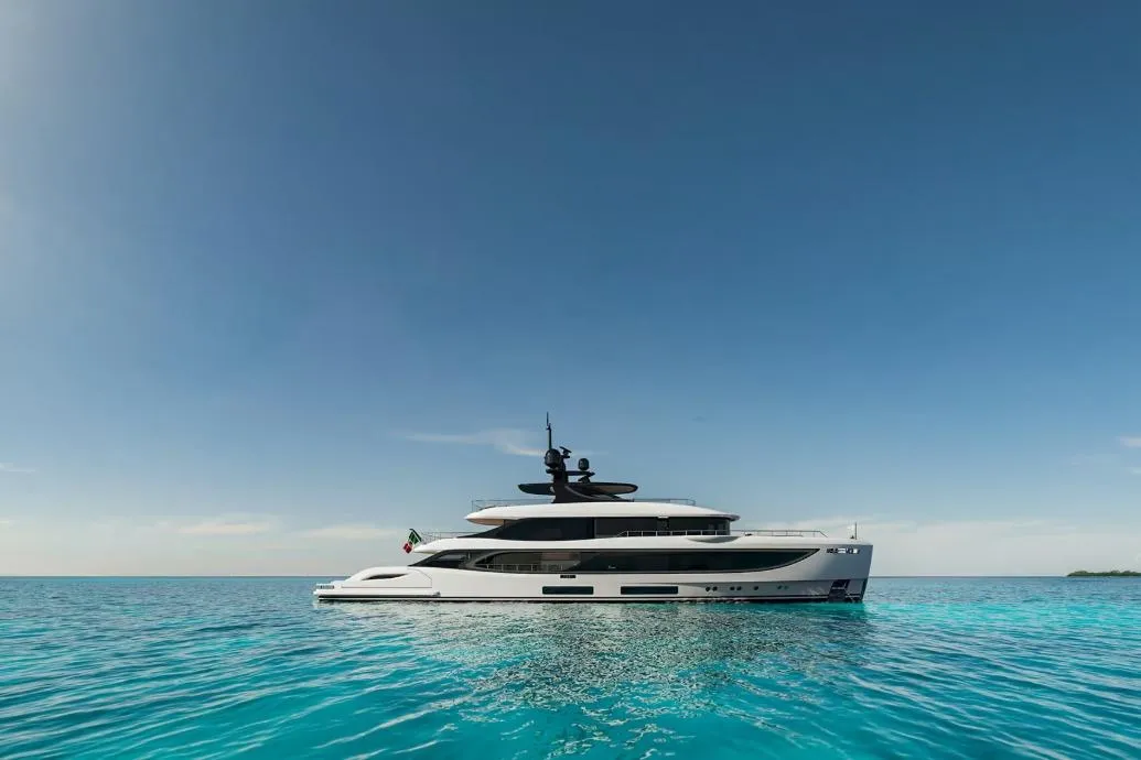 Luxury Benetti Oasis 42M yacht on serene blue ocean, 2028 model.