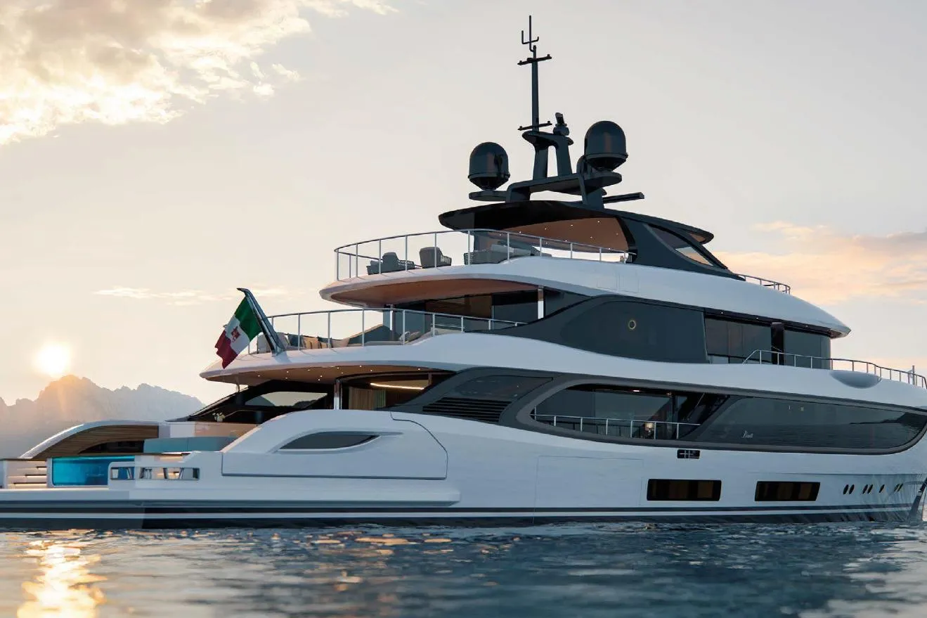 Luxurious 2028 Benetti Oasis 42M Co Ownership yacht at sunset on the water.
