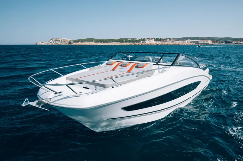  Yacht Photos Pics 2024 Beneteau Flyer 10 cruising on open water, showcasing sleek design and luxury features.