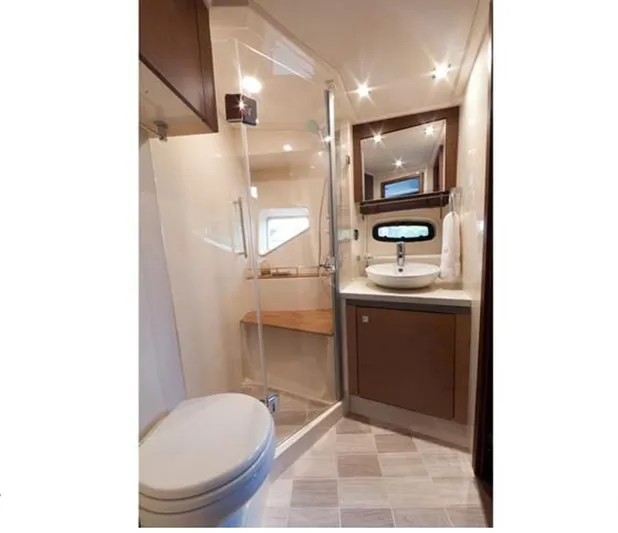 Petrel Yacht Photos Pics Modern bathroom in 2016 Sea Ray 510 Sundancer yacht with shower, sink, and toilet.