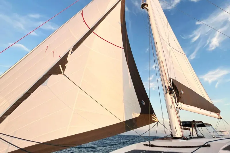 Dauntless Yacht Photos Pics Sailing yacht NEEL 51, 2022 model, with sails unfurled against a clear blue sky.