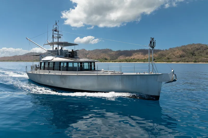 Toccata Yacht Photos Pics Circa Marine FPB64 yacht cruising on clear blue water, 2011 model.