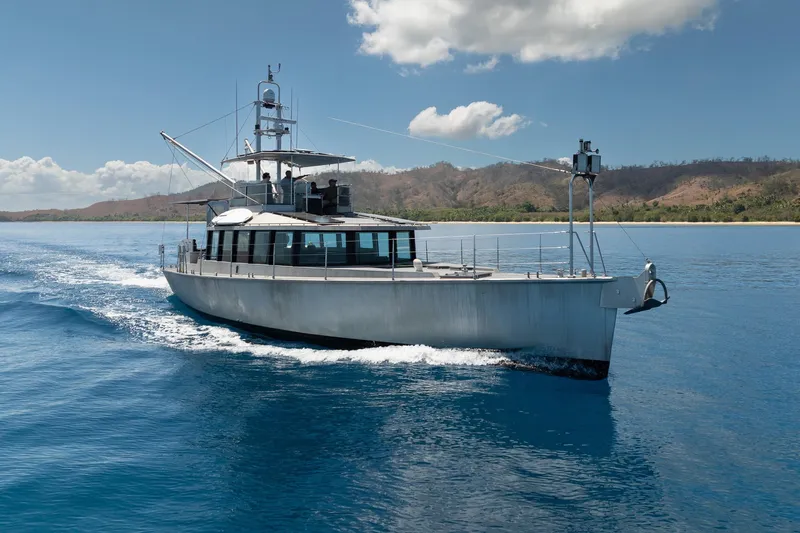 Toccata Yacht Photos Pics 2011 Circa Marine FPB64 yacht cruising on clear blue water under a sunny sky.