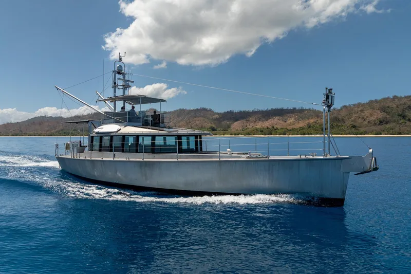 Toccata Yacht Photos Pics 2011 Circa Marine FPB64 yacht cruising on blue waters under a clear sky.
