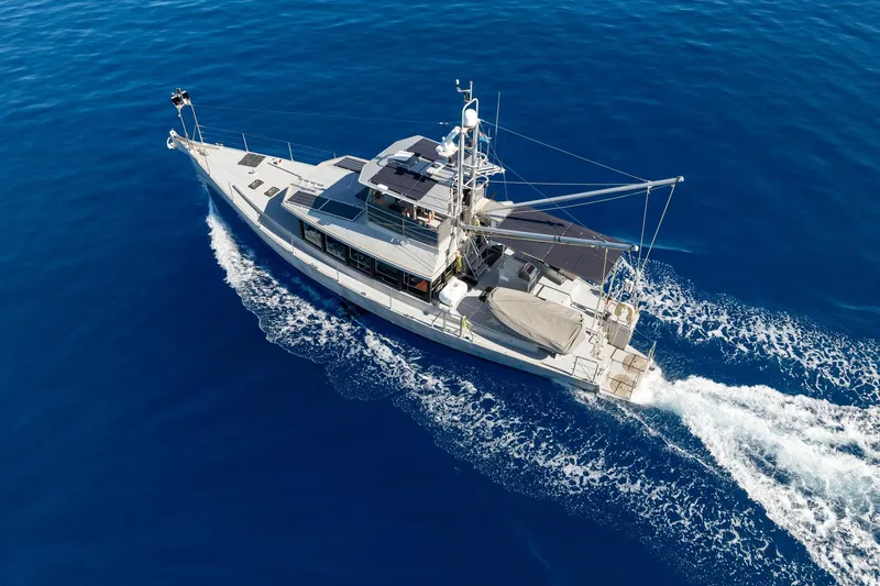 Toccata Yacht Photos Pics Circa Marine FPB64 yacht cruising on open blue sea, 2011 model.