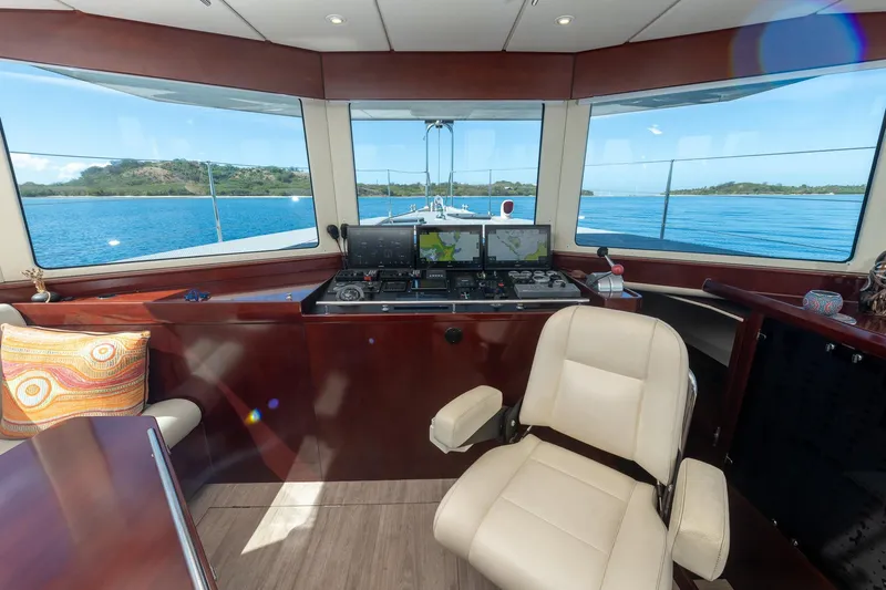 Toccata Yacht Photos Pics Pilothouse of 2011 Circa Marine FPB64 yacht with panoramic ocean views and navigation equipment.