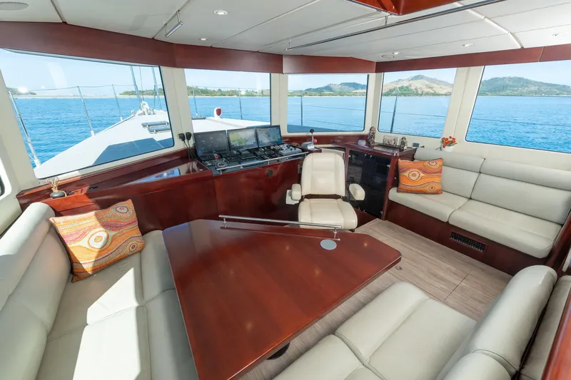 Toccata Yacht Photos Pics Luxurious interior of 2011 Circa Marine FPB64 yacht with panoramic windows and plush seating.