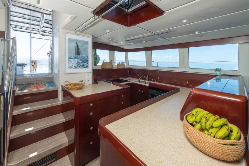 Toccata Yacht Photos Pics Luxurious 2011 Circa Marine FPB64 yacht interior with modern kitchen and ocean view.