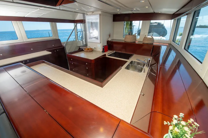 Toccata Yacht Photos Pics Luxurious 2011 Circa Marine FPB64 yacht interior with elegant wood finishes and ocean views.
