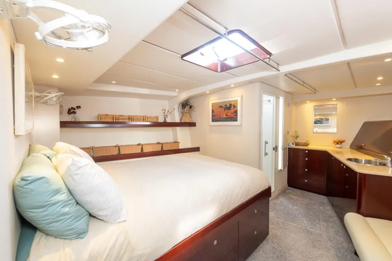 Toccata Yacht Photos Pics Luxurious 2011 Circa Marine FPB64 yacht bedroom with modern decor and elegant furnishings.