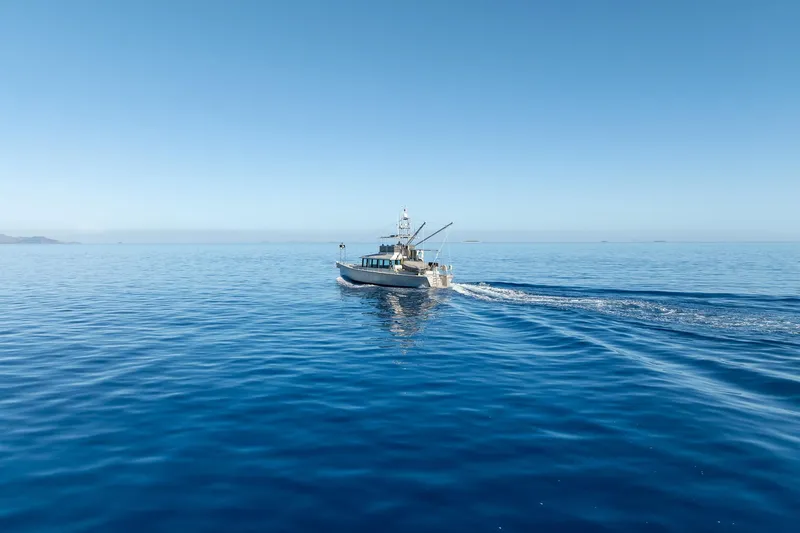Toccata Yacht Photos Pics 2011 Circa Marine FPB64 yacht cruising on calm blue ocean under clear sky.