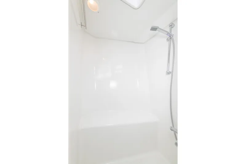 Toccata Yacht Photos Pics Shower area in 2011 Circa Marine FPB64 yacht, featuring modern fixtures and white interior.