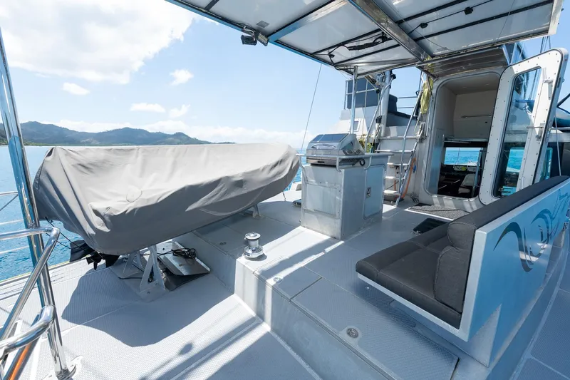 Toccata Yacht Photos Pics Deck of 2011 Circa Marine FPB64 yacht with seating and covered equipment.