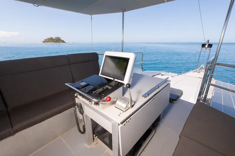 Toccata Yacht Photos Pics Helm of 2011 Circa Marine FPB64 yacht with ocean view and island in background.