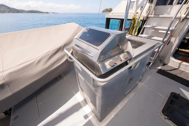 Toccata Yacht Photos Pics Outdoor kitchen on 2011 Circa Marine FPB64 yacht with stainless steel grill.