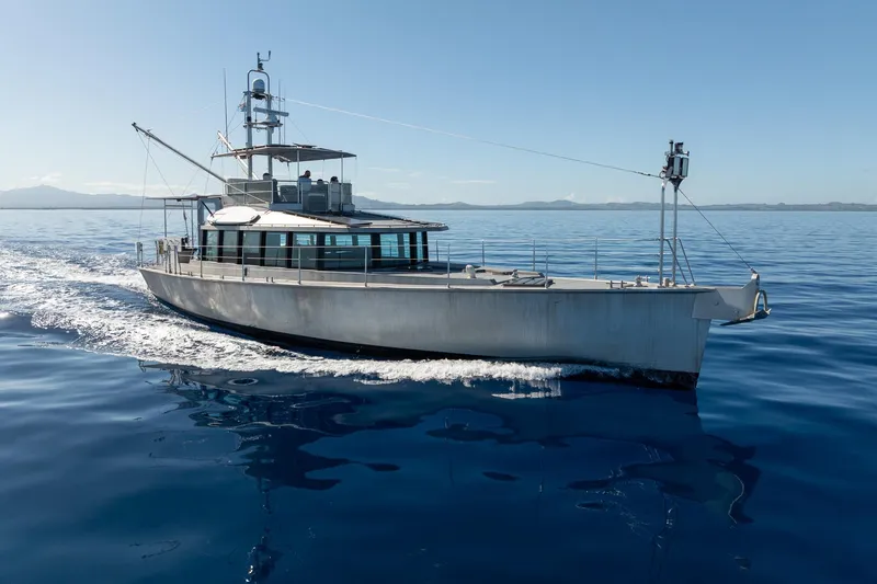 Toccata Yacht Photos Pics 2011 Circa Marine FPB64 yacht cruising on calm blue ocean waters.