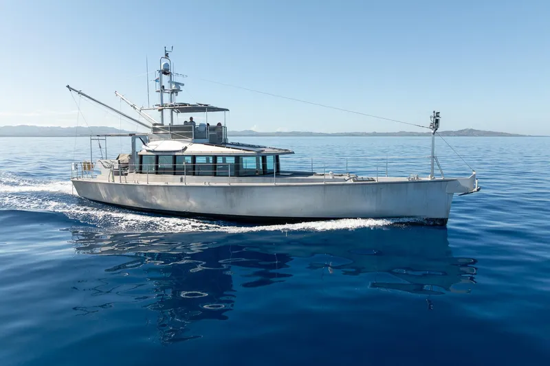 Toccata Yacht Photos Pics Circa Marine FPB64 yacht cruising on calm blue ocean, 2011 model.