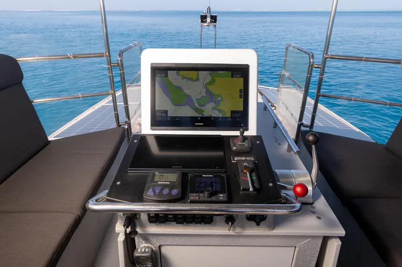 Toccata Yacht Photos Pics Cockpit of 2011 Circa Marine FPB64 yacht with navigation equipment and ocean view.