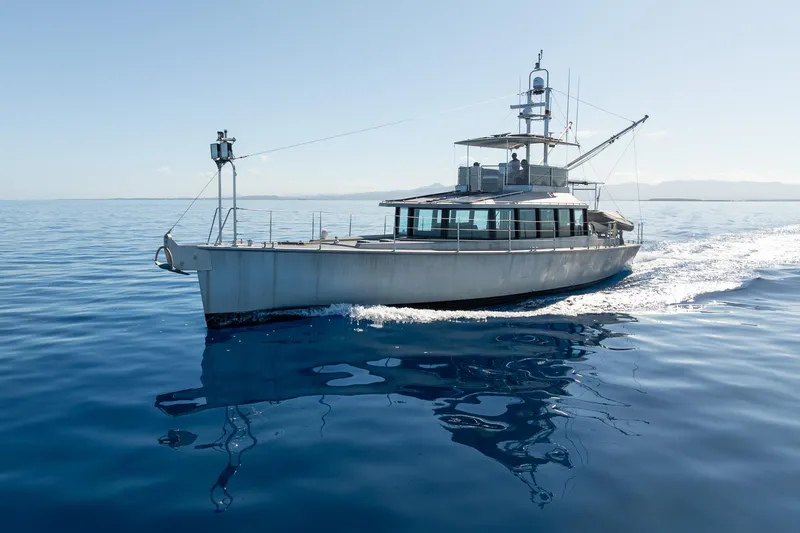 Toccata Yacht Photos Pics Circa Marine FPB64 yacht cruising on calm blue ocean, 2011 model.