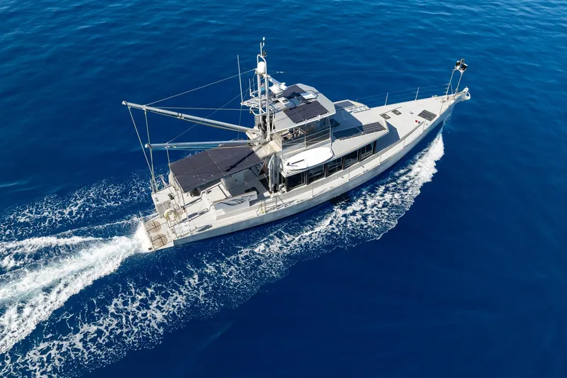 Toccata Yacht Photos Pics Aerial view of 2011 Circa Marine FPB64 yacht cruising on open blue sea.