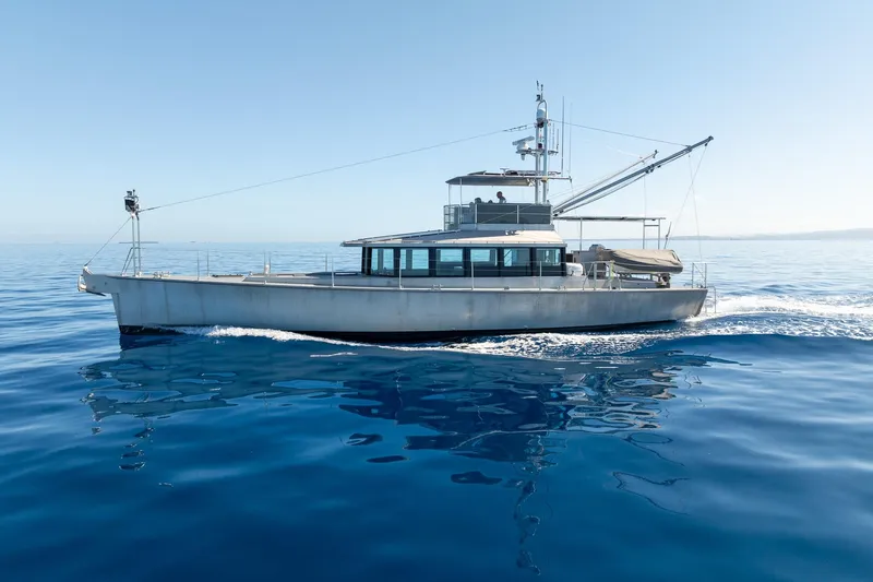 Toccata Yacht Photos Pics 2011 Circa Marine FPB64 yacht cruising on calm blue ocean waters.