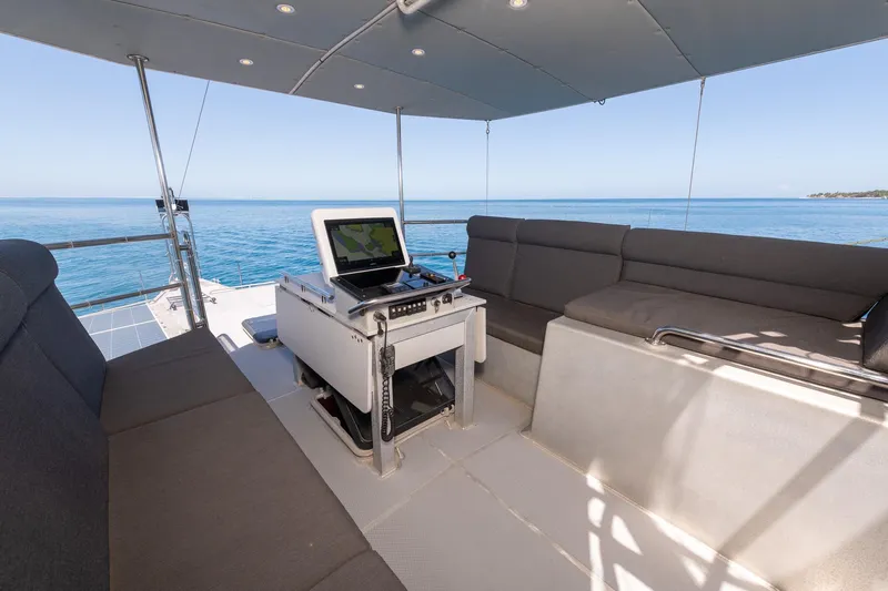 Toccata Yacht Photos Pics Luxurious 2011 Circa Marine FPB64 yacht interior with ocean view and navigation equipment.