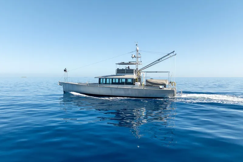 Toccata Yacht Photos Pics 2011 Circa Marine FPB64 yacht cruising on calm blue ocean waters.