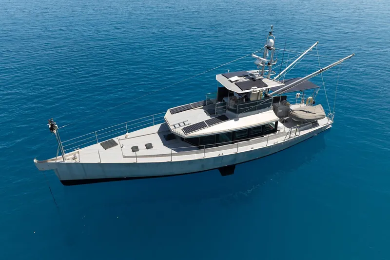 Toccata Yacht Photos Pics Circa Marine FPB64 2011 yacht on calm blue ocean waters, aerial view.