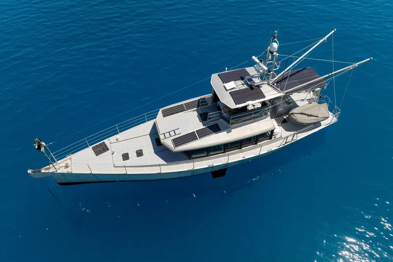 Toccata Yacht Photos Pics Aerial view of 2011 Circa Marine FPB64 yacht on clear blue water.